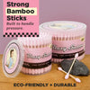 Pink containers of Blazy Susan cotton buds with a pink background and text about bamboo sticks.