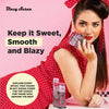 A woman in a red polka-dot dress and matching headscarf poses against a pink background while holding a pack of Blazy Susan cones. The image includes promotional text reading 'Keep it Sweet, Smooth and Blazy' and a circular badge mentioning Blazy Susan cones.