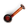 An amber glass hand pipe with a black mouthpiece and bowl, featuring a white stylized logo on the stem, photographed on a clean white background.