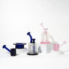 Five Jane West Twenties Collection Water Pipes in blue, clear, and pink are arranged on white display blocks against a clean white studio background.