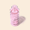 Pink glass bong with a textured design on a light beige background