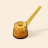 An amber yellow translucent glass smoking pipe by NWTN Home with a fluted bowl and a long straight stem, set against a solid cream background.