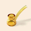 A translucent amber yellow glass water pipe by NWTN Home with a curved stem, photographed on a solid light beige background.